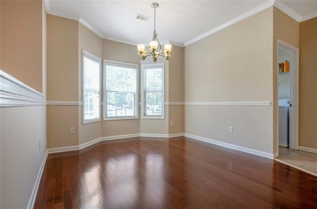 unfurnished dining area with ornamental molding, dark hardwood / wood-style flooring, and a chandelier