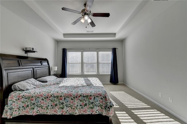 4825 Odum View Ln, Cumming, GA 30040 - bedroom featuring a tray ceiling, light colored carpet, baseboards, and ceiling fan