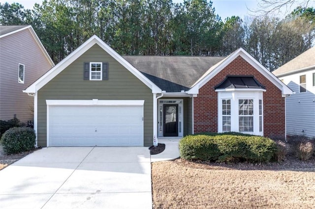 single story home featuring concrete driveway, brick siding, and an attached garage