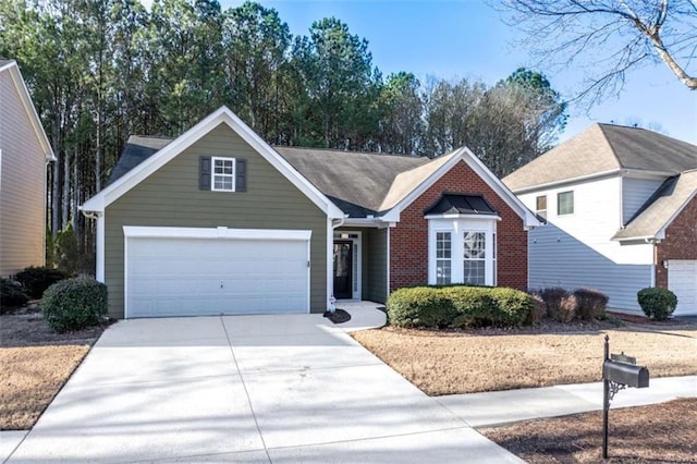 view of front of property featuring concrete driveway and brick siding