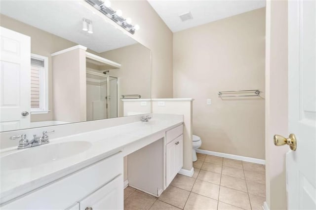 full bathroom with toilet, a sink, tile patterned floors, double vanity, and a stall shower