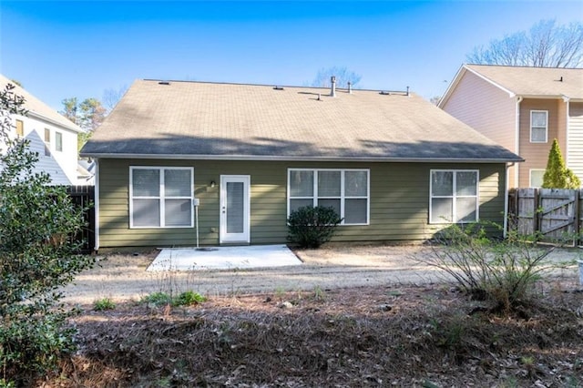 back of house with a patio area and fence