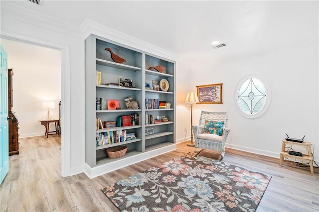 living area with light hardwood / wood-style flooring