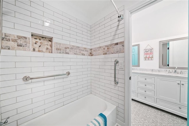 bathroom featuring vanity and tiled shower / bath combo