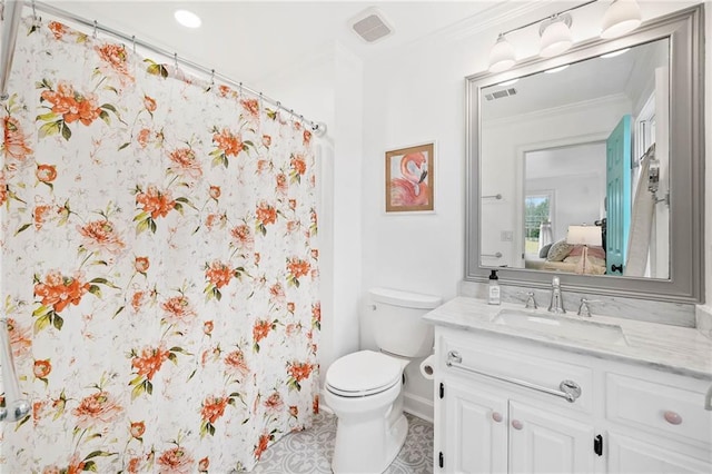 bathroom featuring vanity, tile patterned flooring, crown molding, and toilet