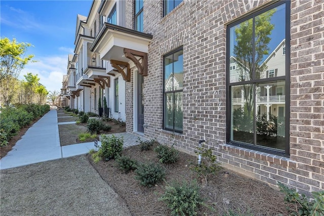 view of side of property featuring a balcony