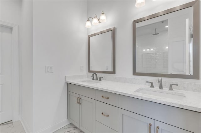 bathroom featuring walk in shower and vanity