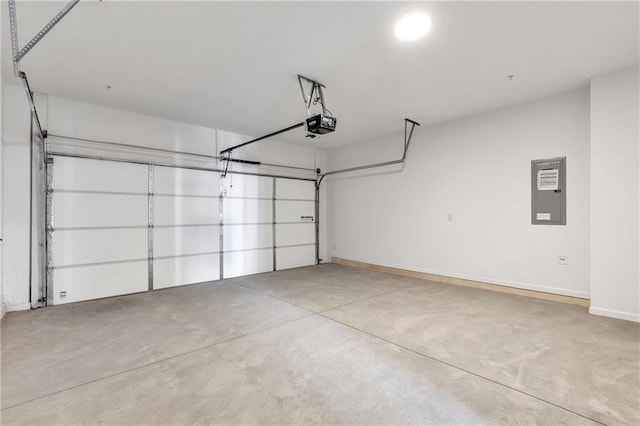 garage with a garage door opener and electric panel