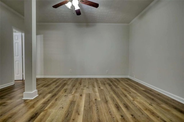 unfurnished room with ceiling fan, wood-type flooring, and ornamental molding