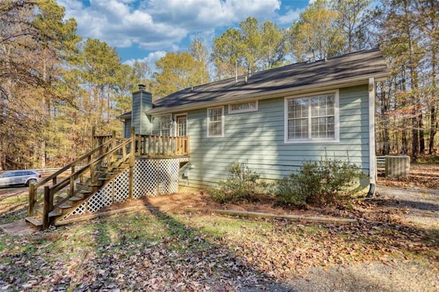 view of side of property featuring a deck