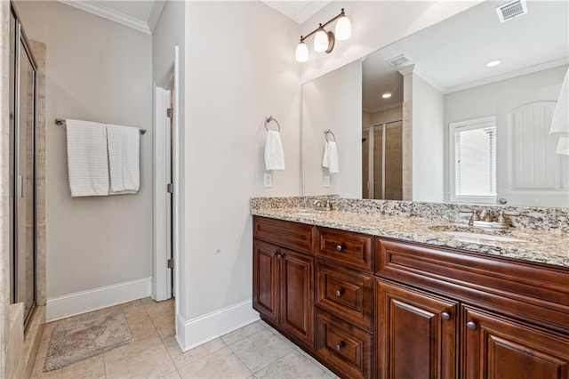 bathroom with crown molding, tile patterned floors, vanity, and a shower with door