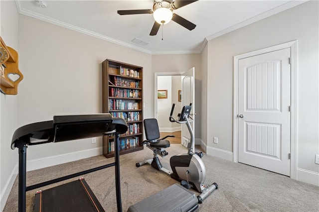 exercise area featuring light colored carpet, ornamental molding, and ceiling fan