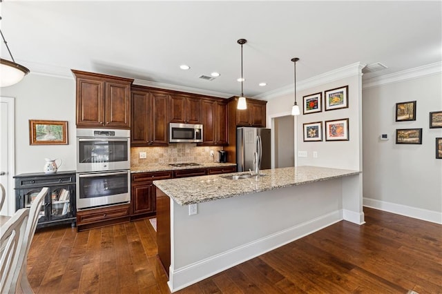 kitchen with dark wood-type flooring, stainless steel appliances, tasteful backsplash, light stone countertops, and decorative light fixtures