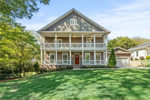 view of front of house with a front yard, a balcony, a porch, ceiling fan, and board and batten siding