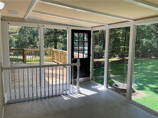 unfurnished sunroom with plenty of natural light