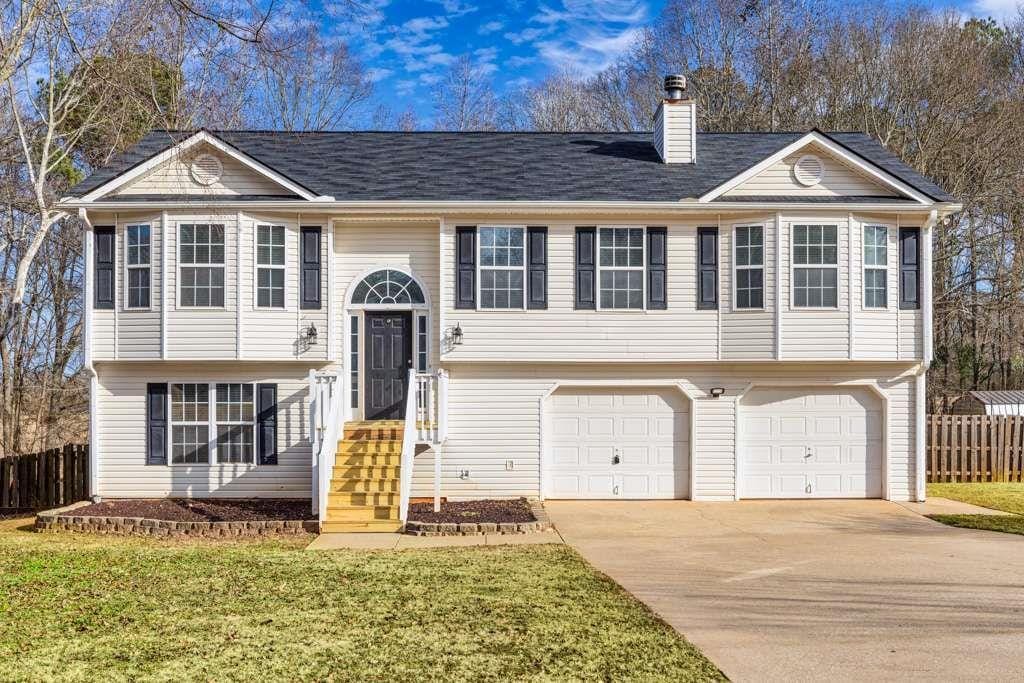 raised ranch featuring a garage