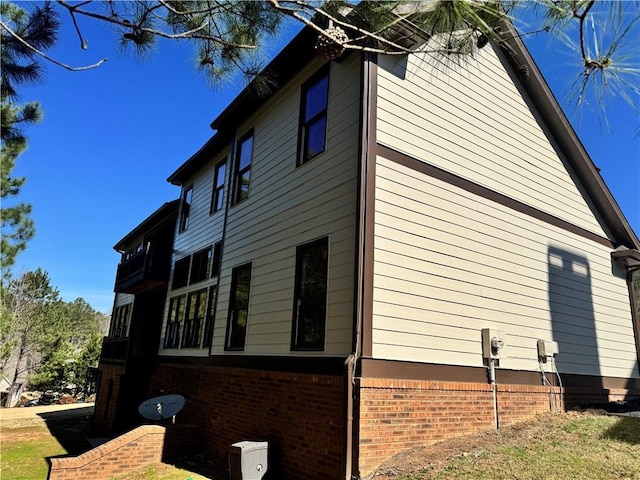 view of property exterior featuring brick siding