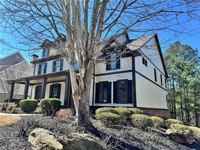 view of front of home featuring brick siding