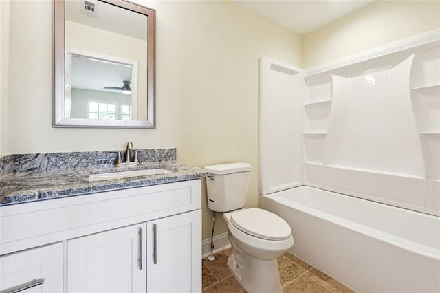 full bathroom with washtub / shower combination, vanity, toilet, and tile patterned flooring