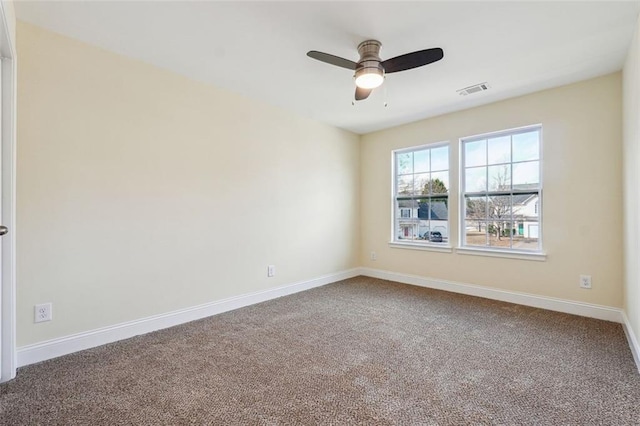 unfurnished room with ceiling fan and carpet flooring