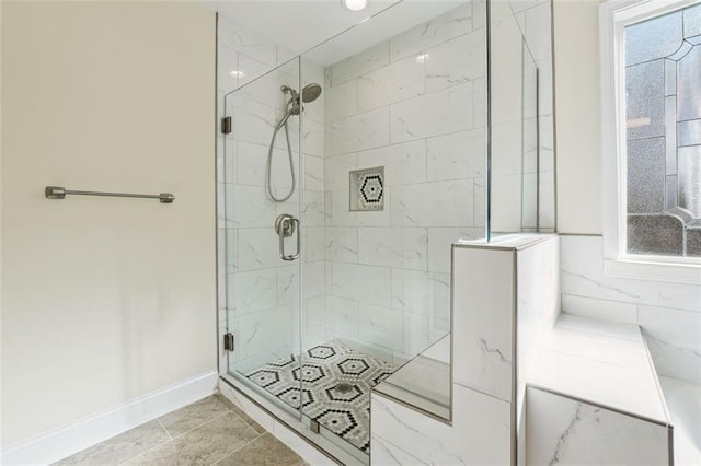 bathroom with tile patterned floors and an enclosed shower