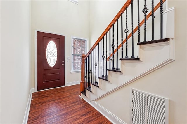 foyer entrance featuring dark hardwood / wood-style floors