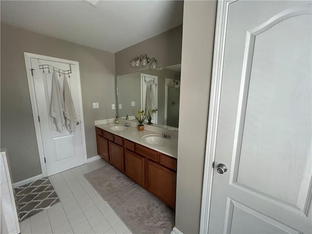 127 Spring Way Sq, Canton, GA 30114 - bathroom with double vanity, tile patterned flooring, and a shower stall