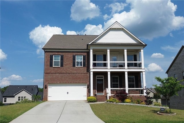 view of front of property featuring a front lawn, a balcony, covered porch, brick siding, and concrete driveway
