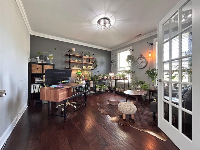 home office with visible vents, ornamental molding, baseboards, and wood finished floors