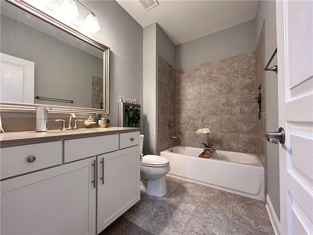 bathroom with vanity, shower / bathing tub combination, visible vents, and toilet