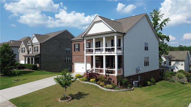 view of front facade featuring a front yard, brick siding, central AC, a balcony, and concrete driveway