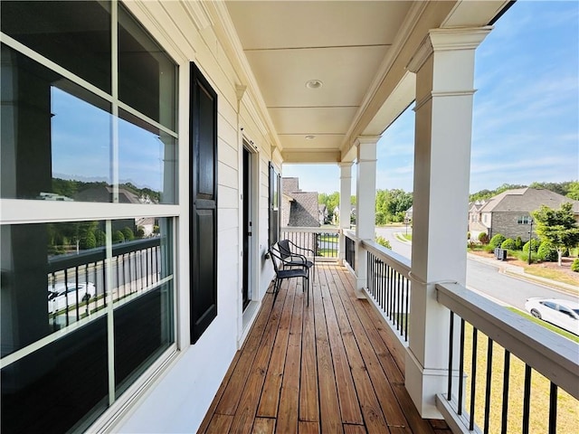 wooden terrace featuring a residential view