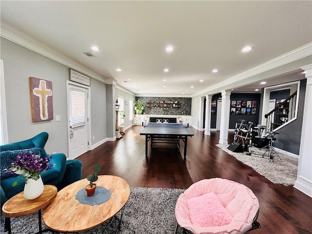 recreation room with recessed lighting, ornamental molding, decorative columns, and dark wood-style floors