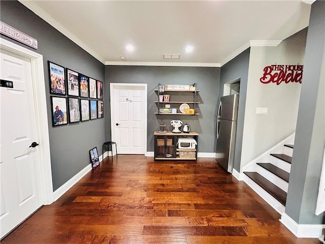 interior space with wood finished floors, baseboards, ornate columns, ornamental molding, and recessed lighting