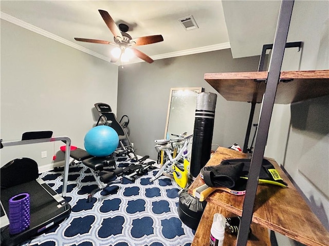 exercise room with a ceiling fan, visible vents, baseboards, ornamental molding, and carpet