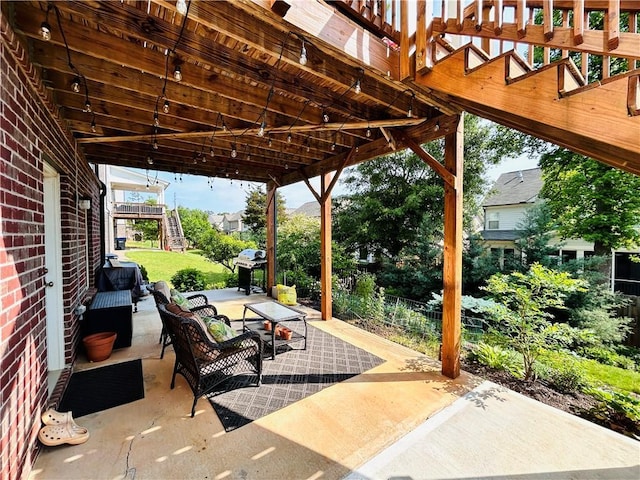 view of patio with an outdoor living space and stairway