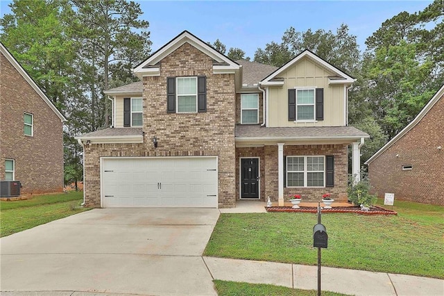 craftsman-style home with cooling unit, a garage, and a front yard