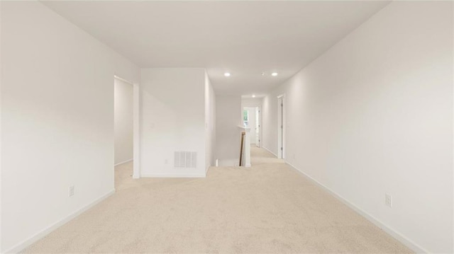 989 Blue Juniper Cir, Loganville, GA 30052 - unfurnished room featuring light carpet, baseboards, visible vents, and recessed lighting