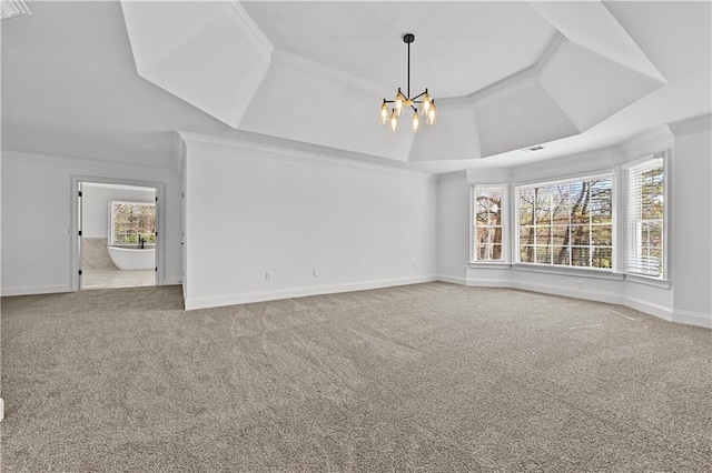 unfurnished living room with an inviting chandelier, crown molding, and carpet