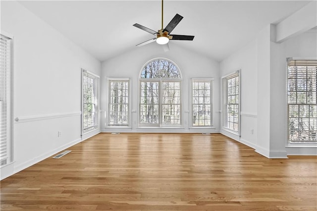 interior space with ceiling fan, visible vents, a wealth of natural light, and light wood-type flooring