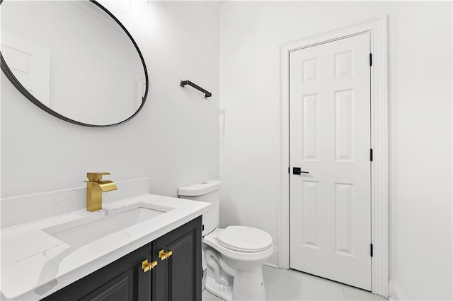 bathroom with toilet and vanity