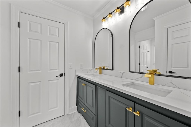 bathroom with a sink, marble finish floor, ornamental molding, and double vanity