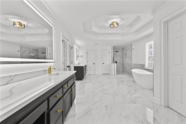 bathroom featuring a shower stall, vanity, marble finish floor, and a tray ceiling