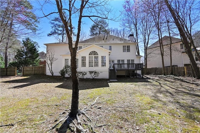 rear view of house with fence, a chimney, stairs, crawl space, and a deck