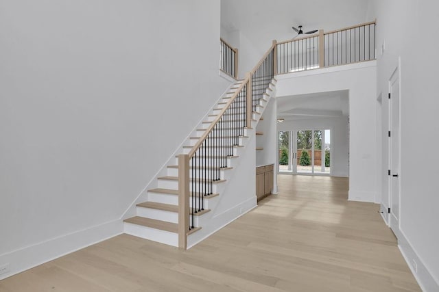315 Hillcrest View Dr, Suwanee, GA 30024 - stairway with wood finished floors, baseboards, and a high ceiling