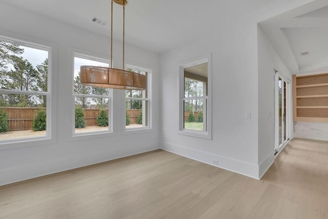 315 Hillcrest View Dr, Suwanee, GA 30024 - unfurnished dining area with light wood-style floors and baseboards