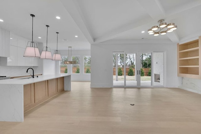 315 Hillcrest View Dr, Suwanee, GA 30024 - kitchen featuring a sink, a chandelier, recessed lighting, beamed ceiling, and modern cabinets
