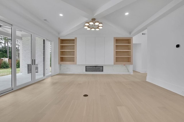 315 Hillcrest View Dr, Suwanee, GA 30024 - unfurnished living room featuring built in shelves, light wood finished floors, beamed ceiling, a chandelier, and baseboards