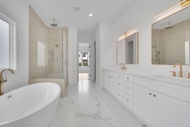 315 Hillcrest View Dr, Suwanee, GA 30024 - full bath with a stall shower, double vanity, a freestanding tub, marble finish floors, and recessed lighting