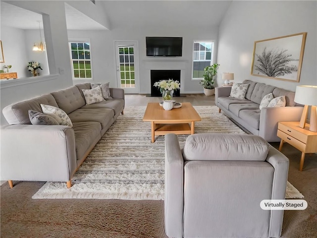 carpeted spare room with a ceiling fan and baseboards